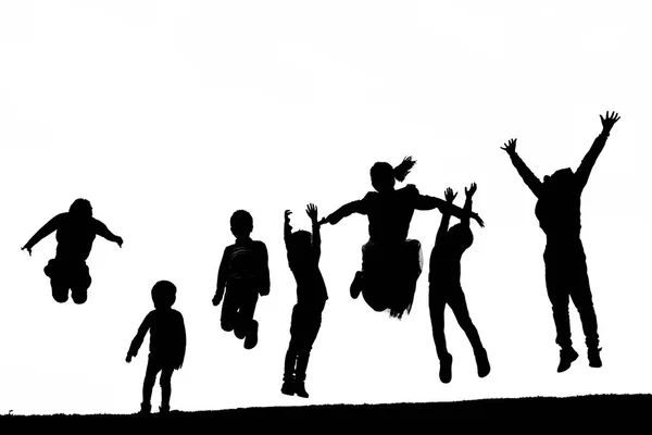 Shadow people jumping on the hill — Stock Photo, Image