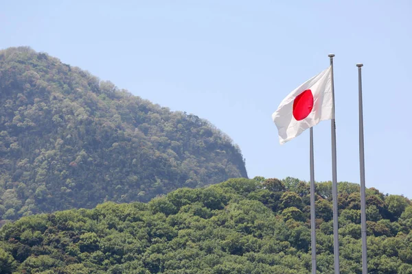 Japonská vlajka ve větru — Stock fotografie