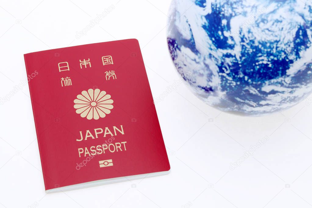 japanese passport and earth globe 