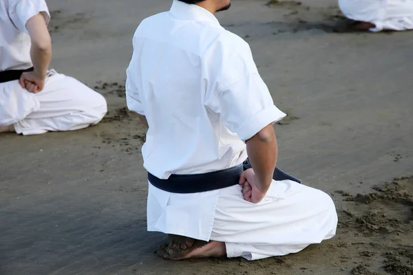 Japanese karate martial arts, spiritual sitting at the beach