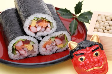 Japanese traditional Setsubun event, Masks of Oni demon and ehomaki sushi are used on an annual event 