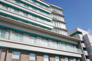 Modern white hospital building with sky in Japan   