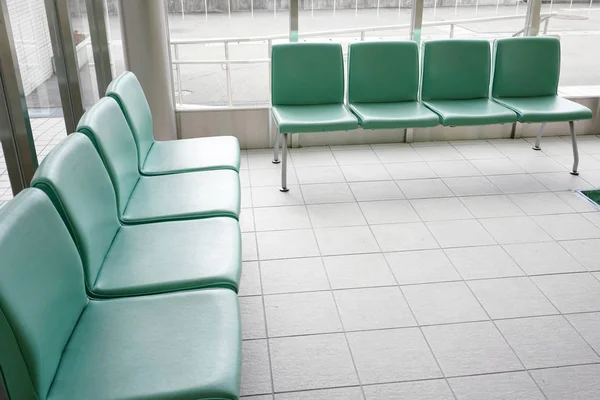 Hospital waiting room with empty chairs