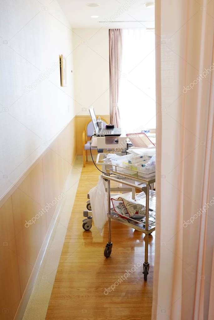 Hospital room with medical curtain and emergency equipment in a Japanese hospital 