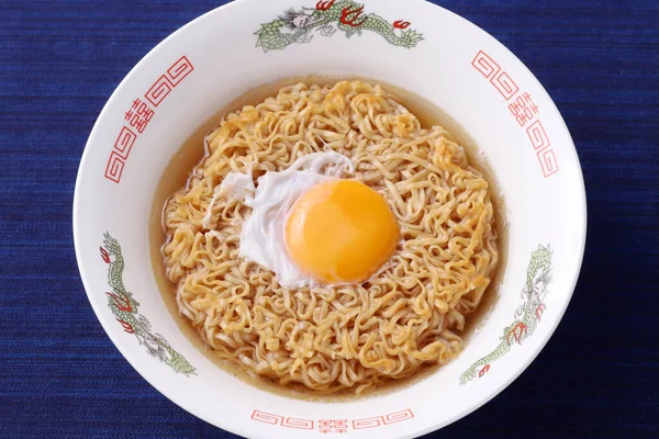 Japanese instant chikin noodles in a bowl on table, top view
