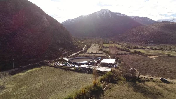 Aerial view of landscape, mountains, valley and horses in Chile