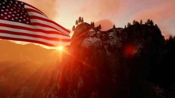 Гора Рашмор с флагом США дует ветер, красивый восход солнца — стоковое видео