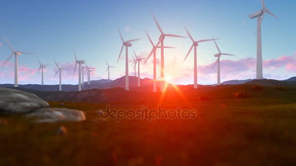 Éoliennes sur le pré vert, rayons de lumière au lever du soleil — Video