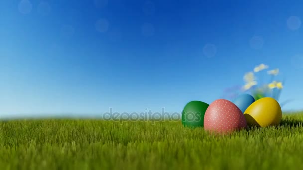 Colorful Easter eggs on green meadow over blue sky — Stock Video