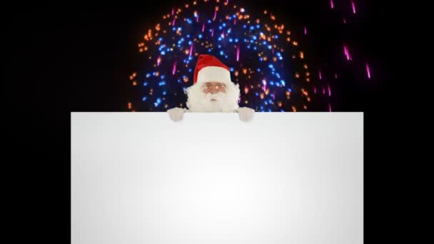 Santa Claus appears behind a white sheet against holiday fireworks — Stock Video