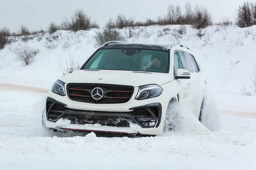 Luxury SUV in deep snow and various weather conditions