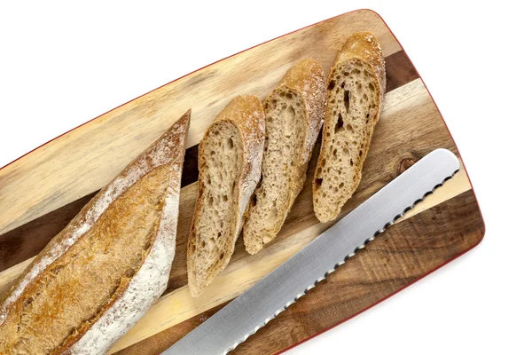 Sliced Bread Stick on Board Top View — Stockfoto