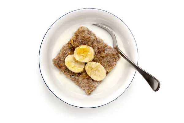 Cuenco de cereales con cuchara vista superior aislado — Foto de Stock