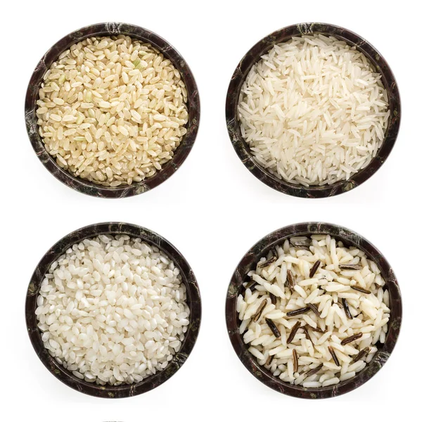 Rijst variëteiten in kommen bovenaanzicht geïsoleerd op wit — Stockfoto