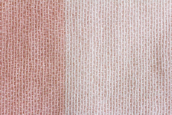 Close - up texture of halus wol kain dalam warna pink dan beige — Stok Foto