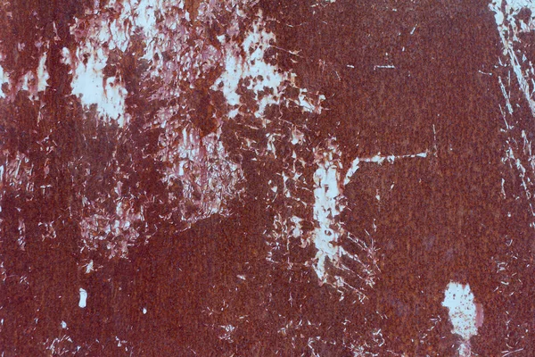 Rusty metal background . Corroded metal sheet with paint residue. Rust on an old metal background Stock Image