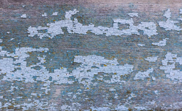 Textura de madera vieja con un frente de pintura azul malhumorado — Foto de Stock