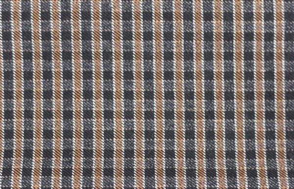 Latar belakang dengan pola checkered. Dark checkered kain dalam warna hitam dan coklat selimut, celana panjang atau kemeja. — Stok Foto