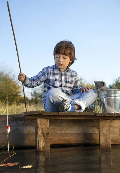 Happy boy go fishing on the river with pet, one children and kit — Stock Photo, Image