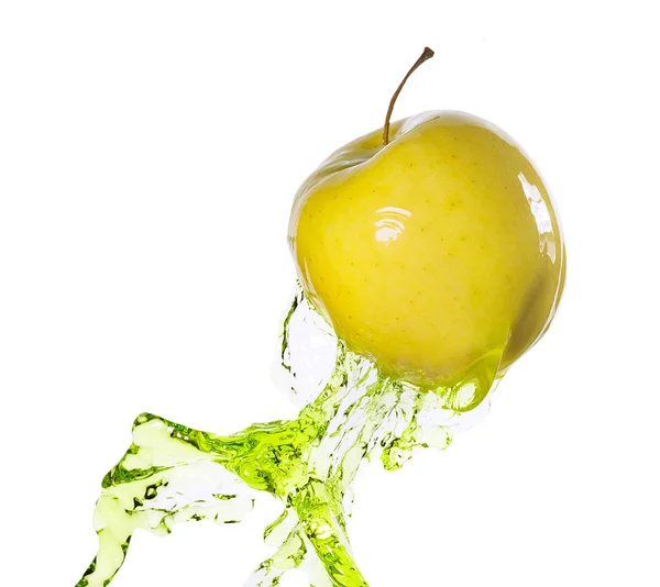 Green apple in juice stream — Stock Photo, Image