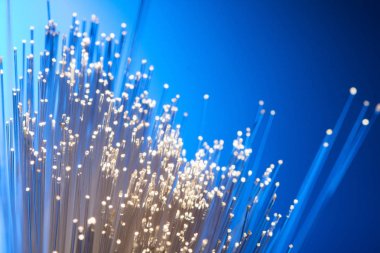 Fiber optik mavi bir arka plan arka ışık çizgiler üzerinde