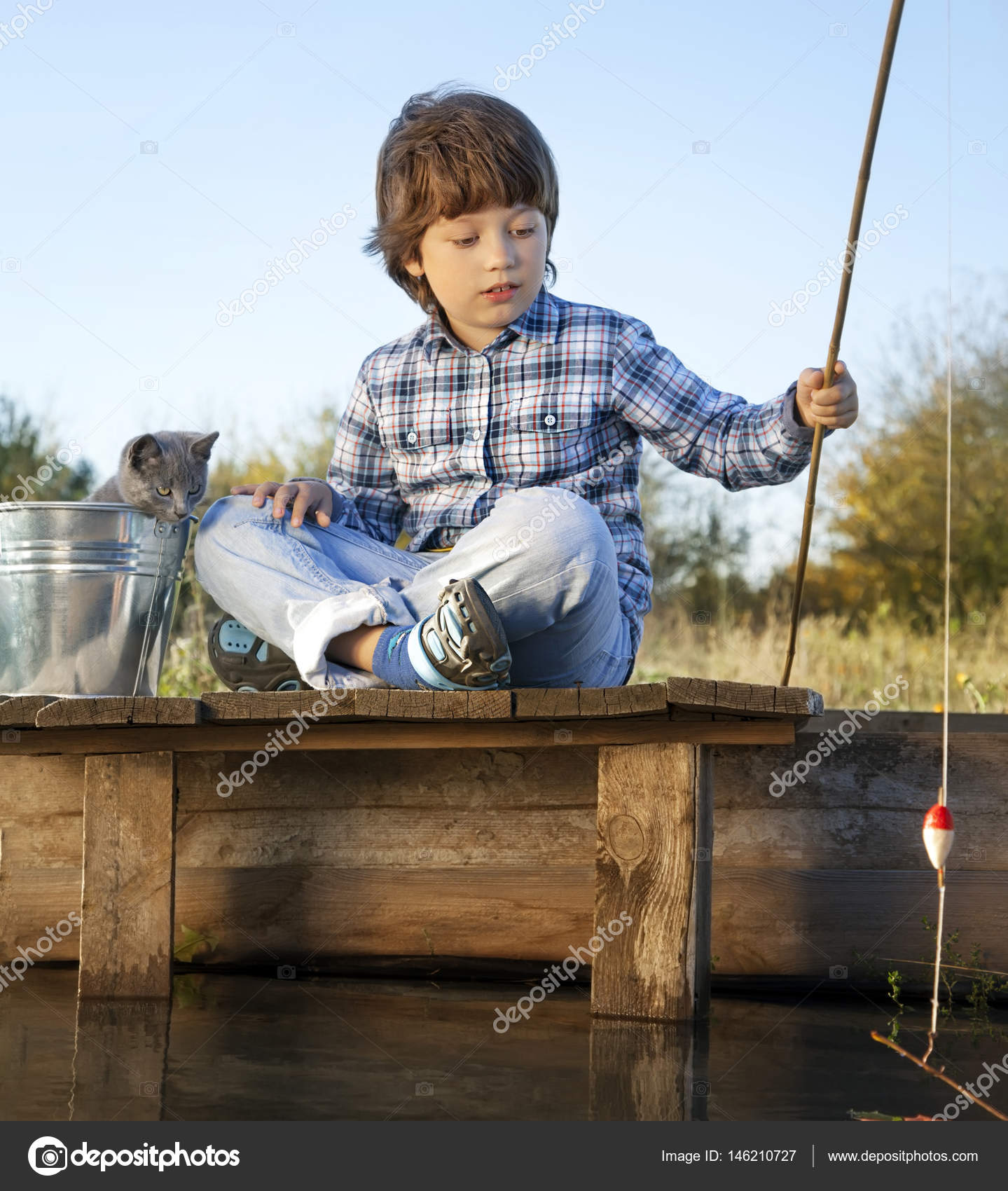 Happy boy go fishing on the river with pet, one children and kit — Stock  Photo © chepko #146210727