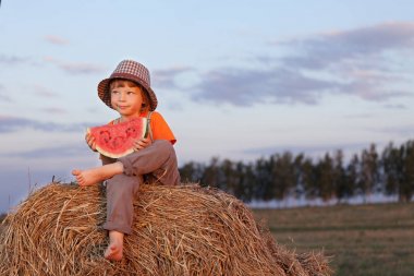 boy eating watermelon