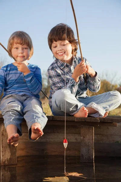 Happy boys go fishing on the river, Two children of the fisherma — Stock Photo, Image