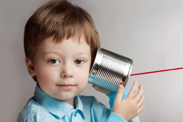 Happy boy play in the tin can phone — Stock Photo, Image