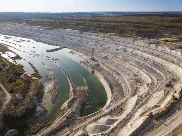 Opencast mining quarry with machinery at work - Aerial view. Ind — Stock Photo, Image