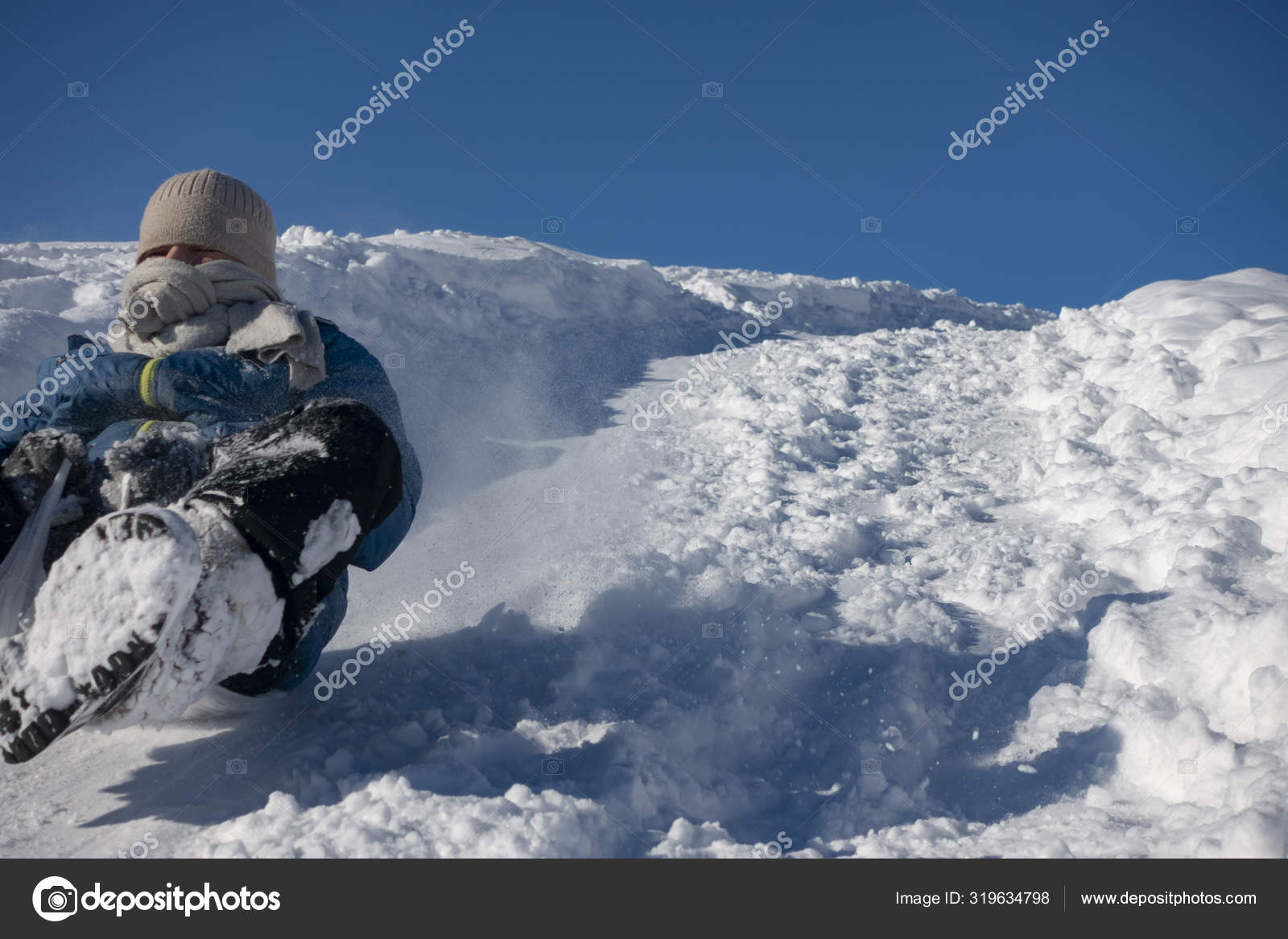 Happy boy sliding down snow hill on sled outdoors in winter, sle Stock  Photo by ©chepko 319634798