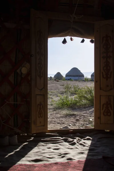Yurt door nomadic houses camp at mountain valley in Central Asia