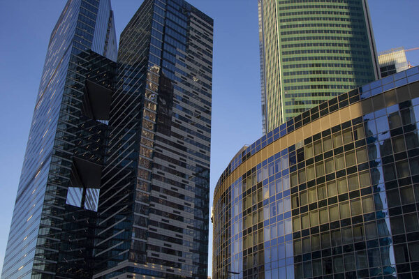 Modern skyscrapers in business district in evening light at sunset