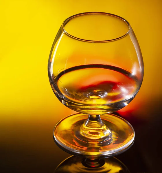 Glass of whiskey or cognac on black background with space for te — Stock Photo, Image