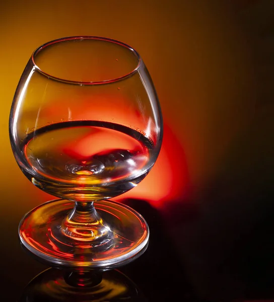 Glass of whiskey or cognac on black background with space for te — Stock Photo, Image