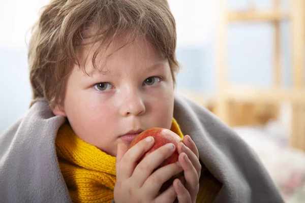 Sick Boy Warm Clothes Holding Fruit Home — Stock Photo, Image