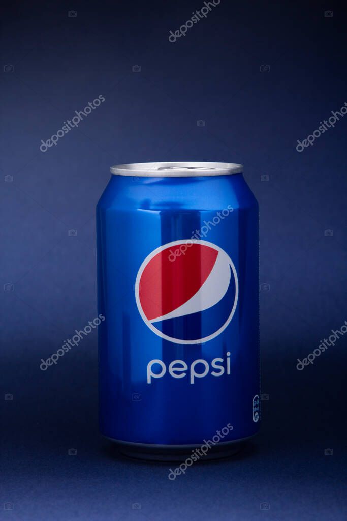 Belgorod , Russia - MAY, 17, 2020: Pepsi drink in a can on ice isolated on blue background. Carbonated soft drink produced by PepsiCo.