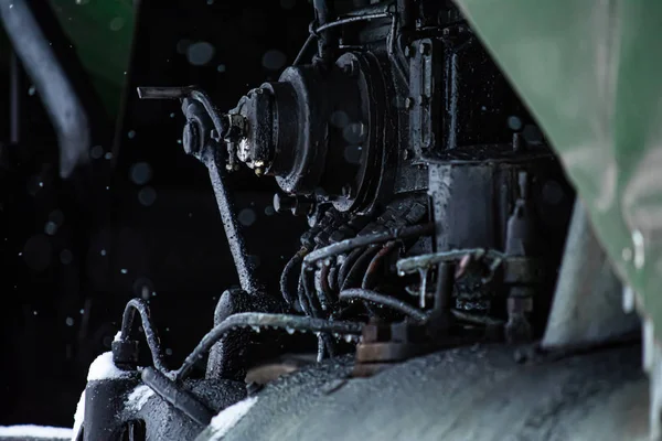 New Year\'s steam engine in the winter. Close-up of an old snow-c