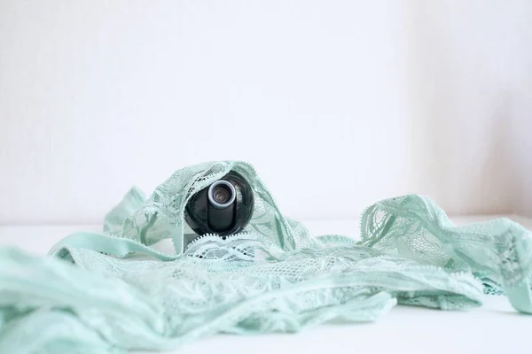 Webcam Hidden in women\'s underwear for covert surveillance of the house. Surveillance and security systems. Smart House. Espionage. Hidden camera for watching