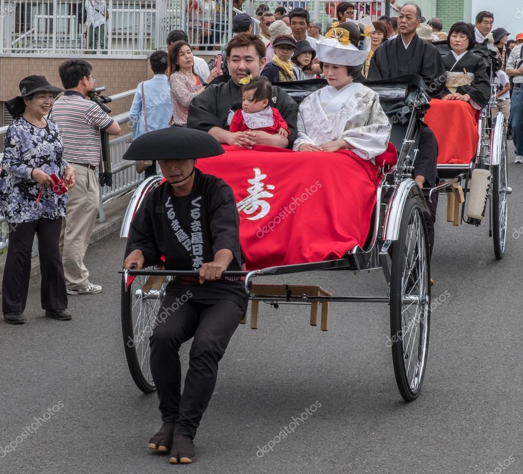 Japanese Bride And Groom In Traditional Costume In Rickshaw