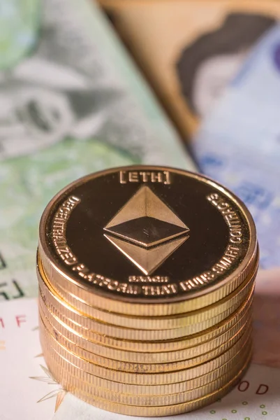 Ethereum coin on South Korean won bank notes