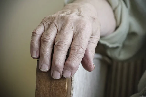 wrinkled hand of a senior person