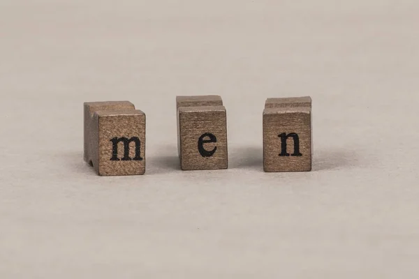 " men "written by wooden letters — стоковое фото