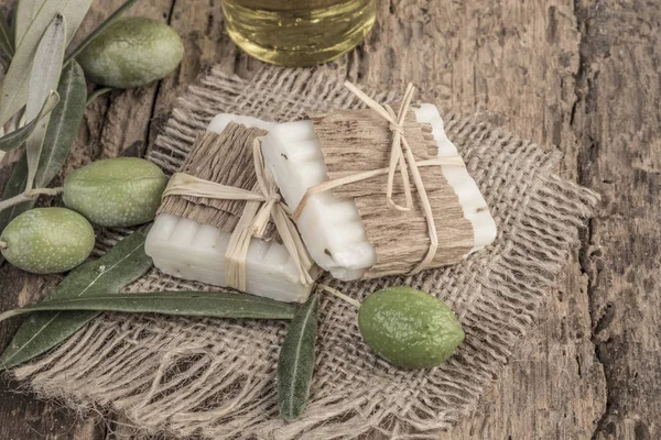 Natural olive oil soap bars on wooden table — Stock Photo, Image