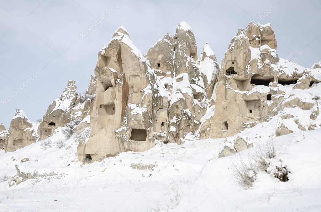 unique geological rock formations under snow in Cappadocia, Turk