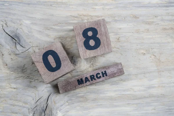 Modelo de saudação do dia das mulheres com calendário cubo para março — Fotografia de Stock