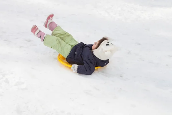 Girl sledging down hills winter — Stock Photo, Image