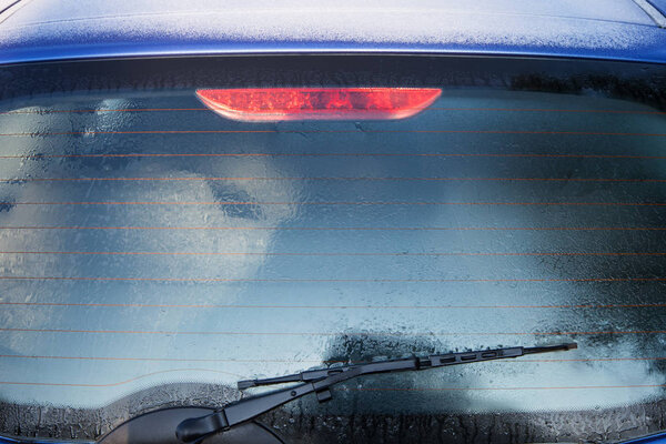 Frozen rear window of car