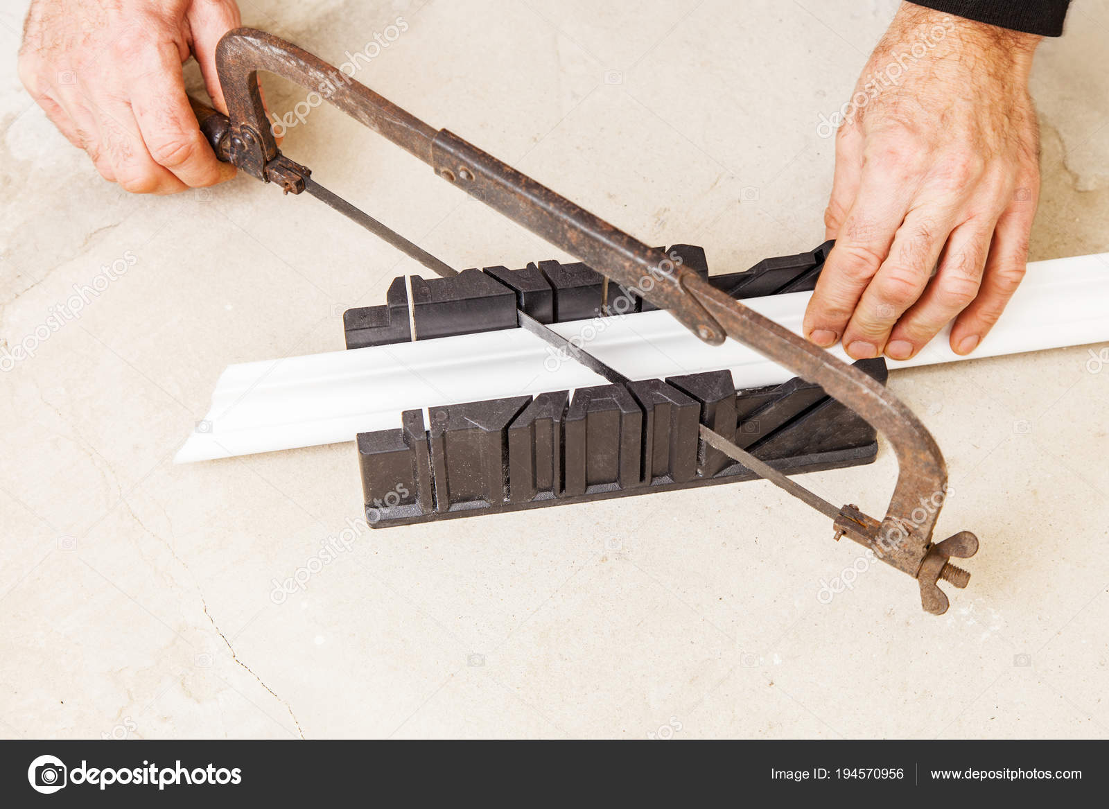 Cutting Ceiling Skirting In Miter Box Stock Photo