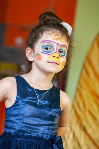 Portrait of baby girl with painted face — Stock Photo, Image